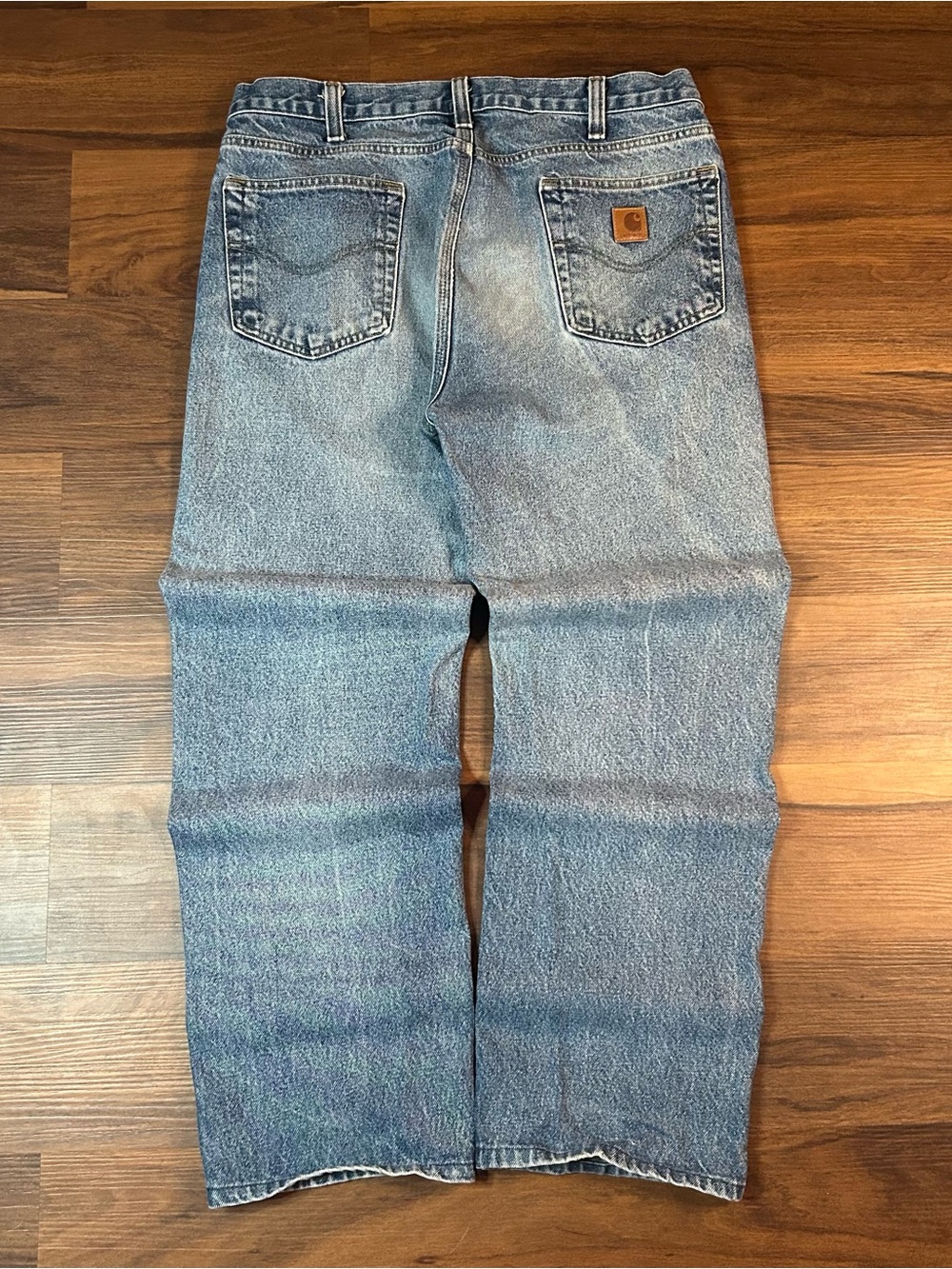 Carhartt Men's Relaxed Jeans in Light Blue Denim with Logo Patch